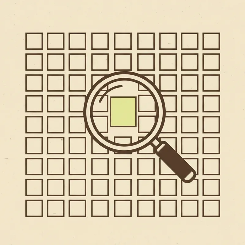 A grid of small blank paper squares with a magnifier held over one square tinted pale green